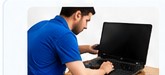 Technician servicing laptop